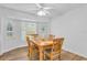 Bright dining room with bay window and wood table and chairs at 17402 Billiar Ave, Port Charlotte, FL 33948
