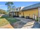 Back exterior view, showing screened porch and AC unit at 17402 Billiar Ave, Port Charlotte, FL 33948