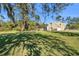 House exterior with large yard and trees at 17402 Billiar Ave, Port Charlotte, FL 33948