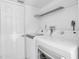 Laundry room with washer, dryer, and overhead shelving at 17402 Billiar Ave, Port Charlotte, FL 33948
