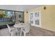Screened porch with french doors and outdoor furniture at 17402 Billiar Ave, Port Charlotte, FL 33948