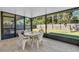 Relaxing screened porch with outdoor dining set at 17402 Billiar Ave, Port Charlotte, FL 33948