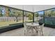 Relaxing screened porch with outdoor dining set at 17402 Billiar Ave, Port Charlotte, FL 33948