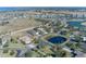 Aerial view of homes and a pond in a residential area at 1929 24Th Street W Cir, Palmetto, FL 34221