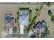 Aerial view of three homes with pools and lush landscaping at 1929 24Th Street W Cir, Palmetto, FL 34221