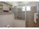 Shower stall with beige tile surround and built in shelving at 1929 24Th Street W Cir, Palmetto, FL 34221