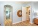 Light blue bathroom with a large soaking tub and hardwood floors at 1929 24Th Street W Cir, Palmetto, FL 34221