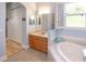 Primary bathroom with double vanity, soaking tub and access to a walk-in closet at 1929 24Th Street W Cir, Palmetto, FL 34221