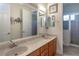 Double vanity bathroom with beige tile floors and shower at 1929 24Th Street W Cir, Palmetto, FL 34221