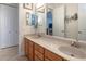 Double vanity bathroom with a large mirror and beige countertop at 1929 24Th Street W Cir, Palmetto, FL 34221