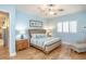 Bedroom with a comfortable bed, light blue walls, and hardwood flooring at 1929 24Th Street W Cir, Palmetto, FL 34221