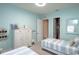Twin bedroom with light blue walls and coastal decor at 1929 24Th Street W Cir, Palmetto, FL 34221
