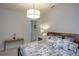 King-size bedroom with wood furniture and world map bedding at 1929 24Th Street W Cir, Palmetto, FL 34221