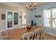 Dining room with wooden table, white chairs and a chandelier at 1929 24Th Street W Cir, Palmetto, FL 34221