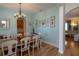 Dining room with wooden table, white chairs and a chandelier at 1929 24Th Street W Cir, Palmetto, FL 34221