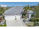 Beautiful single-Gathering home with tile roof, two-car garage, and lush landscaping at 1929 24Th Street W Cir, Palmetto, FL 34221