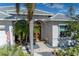 Elegant front entry with double doors and a beautifully landscaped walkway at 1929 24Th Street W Cir, Palmetto, FL 34221
