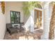 Relaxing front porch with wicker chairs, perfect for enjoying the outdoors at 1929 24Th Street W Cir, Palmetto, FL 34221