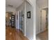 Light-filled hallway with hardwood floors, leading to other rooms at 1929 24Th Street W Cir, Palmetto, FL 34221
