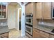 Kitchen features stainless steel appliances and access to laundry room at 1929 24Th Street W Cir, Palmetto, FL 34221