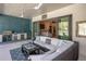Outdoor kitchen with built-in grill and seating area at 1929 24Th Street W Cir, Palmetto, FL 34221
