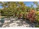 Charming patio area with wrought iron furniture, surrounded by lush greenery at 1929 24Th Street W Cir, Palmetto, FL 34221