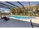 Screened pool and spa with lounge chairs at 1929 24Th Street W Cir, Palmetto, FL 34221