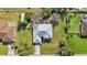 Aerial view of a single-Gathering home and surrounding neighborhood at 23159 Allen Ave, Punta Gorda, FL 33980