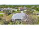 Aerial view of house, yard, and neighborhood at 23159 Allen Ave, Punta Gorda, FL 33980