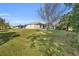 Large backyard with spacious lawn and mature trees at 23159 Allen Ave, Punta Gorda, FL 33980