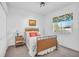 Cozy bedroom with wicker bed frame and window seat at 23159 Allen Ave, Punta Gorda, FL 33980
