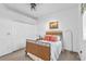 Bright bedroom with wicker bed frame and double closet at 23159 Allen Ave, Punta Gorda, FL 33980