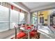 Bright dining area with glass table and red chairs at 23159 Allen Ave, Punta Gorda, FL 33980
