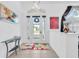 Bright entryway with glass front door and colorful rug at 23159 Allen Ave, Punta Gorda, FL 33980