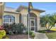 Home exterior showcasing a well-maintained front entrance and landscaping at 23159 Allen Ave, Punta Gorda, FL 33980