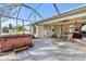 Relaxing hot tub on patio with screened enclosure at 23159 Allen Ave, Punta Gorda, FL 33980