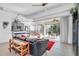 Living room with view of patio and kitchen at 23159 Allen Ave, Punta Gorda, FL 33980