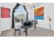 Elegant music room featuring a grand piano and large windows at 23159 Allen Ave, Punta Gorda, FL 33980