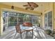 Relaxing screened patio with hot tub and seating area at 23159 Allen Ave, Punta Gorda, FL 33980