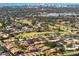 Aerial view showing a residential community near a golf course and body of water at 2321 Beneva Ter # 2288, Sarasota, FL 34232