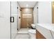 Spa-like bathroom with a glass shower and wooden feature wall at 2321 Beneva Ter # 2288, Sarasota, FL 34232
