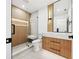 Spa-like bathroom with a glass shower and wooden feature wall at 2321 Beneva Ter # 2288, Sarasota, FL 34232