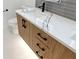 Bathroom vanity with marble countertop, light wood cabinets, and black hardware at 2321 Beneva Ter # 2288, Sarasota, FL 34232