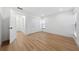 Bright bedroom featuring light wood floors and an ensuite bathroom at 2321 Beneva Ter # 2288, Sarasota, FL 34232
