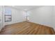 Spacious bedroom with light wood floors and large windows at 2321 Beneva Ter # 2288, Sarasota, FL 34232