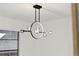 Contemporary chandelier, adding elegance to the dining area at 2321 Beneva Ter # 2288, Sarasota, FL 34232