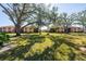 View of condo community with large trees and grassy areas at 2321 Beneva Ter # 2288, Sarasota, FL 34232