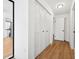 Clean hallway with light wood floors and white shutters at 2321 Beneva Ter # 2288, Sarasota, FL 34232