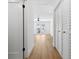 Hallway with light wood floors and white walls at 2321 Beneva Ter # 2288, Sarasota, FL 34232