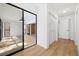 Bright hallway featuring light wood floors and access to patio at 2321 Beneva Ter # 2288, Sarasota, FL 34232